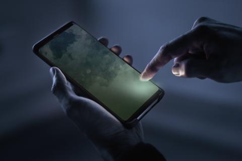 Hand holding a mobile phone