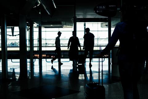 Silhouette of people in airport terminal