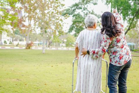 Younger person assisting an elderly person
