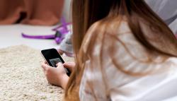 Child viewing image on a mobile phone