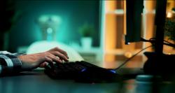 Person typing at computer's keyboard