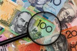 Australian bank notes with magnifying glass over top of notes