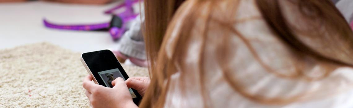 Child viewing image on a mobile phone