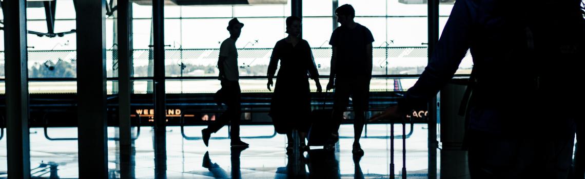 Silhouette of people in airport terminal