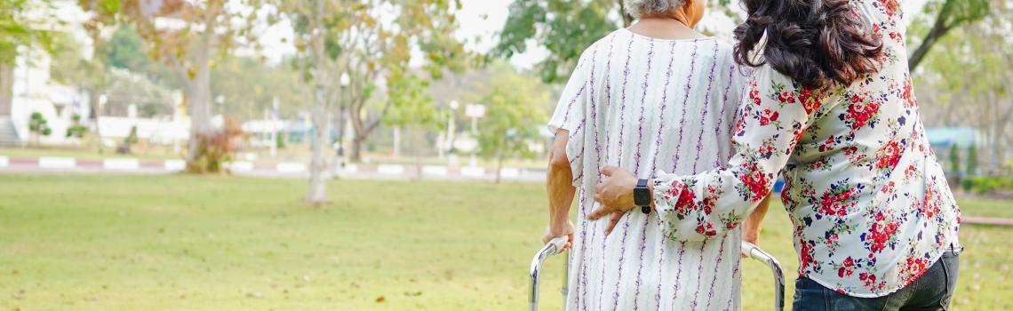Younger person assisting an elderly person